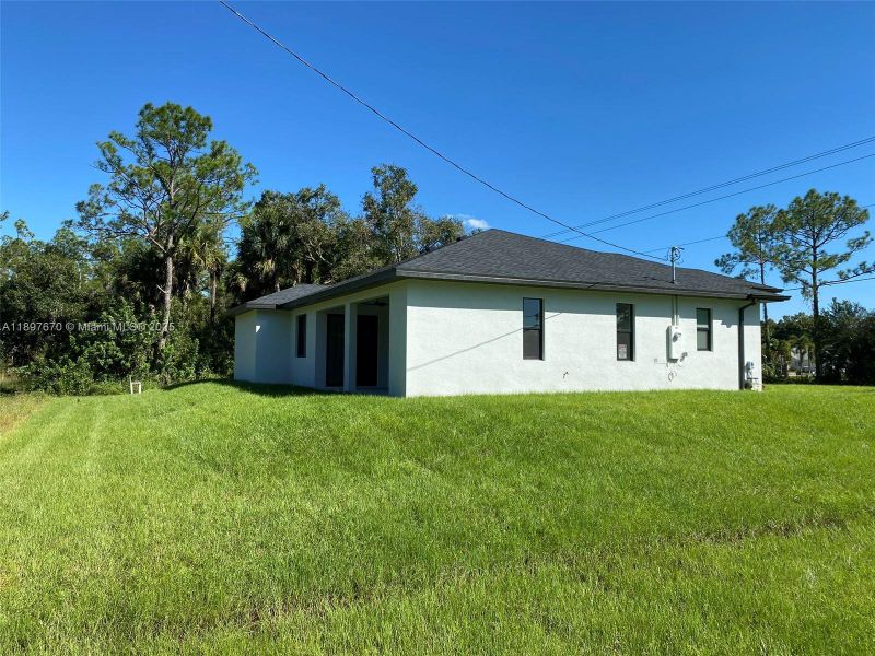 Exterior details and patio area of a home in , Lehigh Acres (Image 25). Exterior details and patio area of a home in , Lehigh Acres (Image 25).
