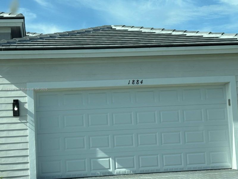 Front exterior of a new home in , Homestead, FL, highlighting curb appeal (Image 1). Front exterior of a new home in , Homestead, FL, highlighting curb appeal (Image 1).