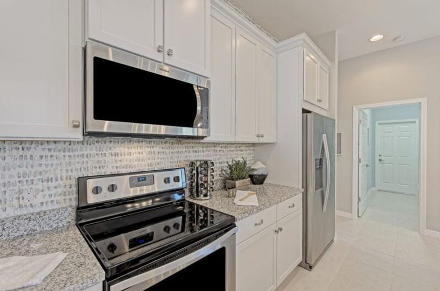 Representative furnished interior of a home built from the Harbour by Medallion Home in The Willows, Parrish (Image 9).