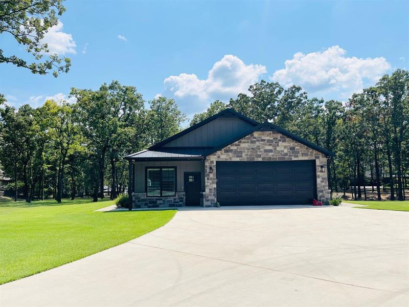 Front exterior of a new home in , Yantis, TX, highlighting curb appeal (Image 2). Front exterior of a new home in , Yantis, TX, highlighting curb appeal (Image 2).