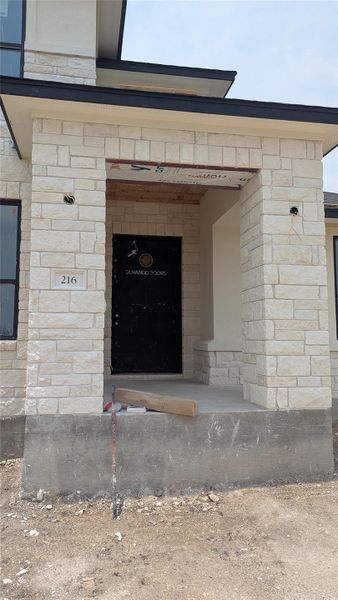 Front exterior of a new home in Scofield Farms Estates, Georgetown, TX, highlighting curb appeal (Image 20). Front exterior of a new home in Scofield Farms Estates, Georgetown, TX, highlighting curb appeal (Image 20).