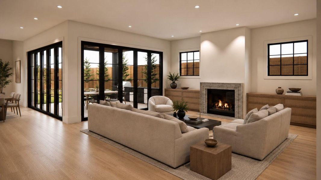 Rendering: Living area with fireplace and accordion doors leading to covered patio.