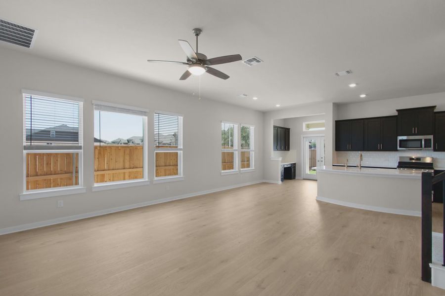 Representative unfurnished interior of a home built from the Warner by Chesmar Homes in The Grove at Blackhawk, Pflugerville (Image 6).
