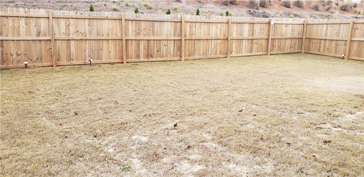 Exterior details and patio area of a home in Greyson Parc, Locust Grove (Image 22).