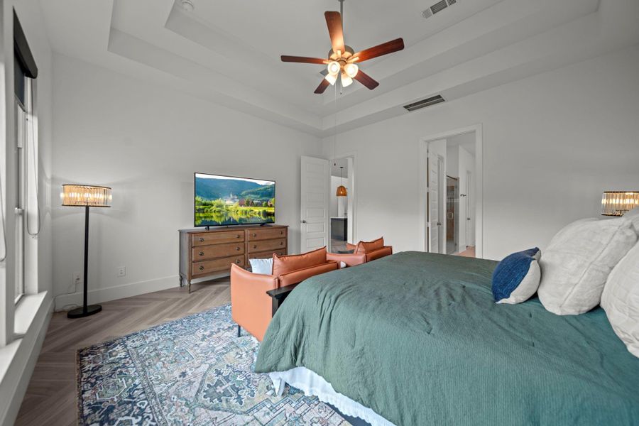 Another perspective of the primary suite shows its size and layout, combining comfort with functionality. Another perspective of the primary suite shows its size and layout, combining comfort with functionality.
