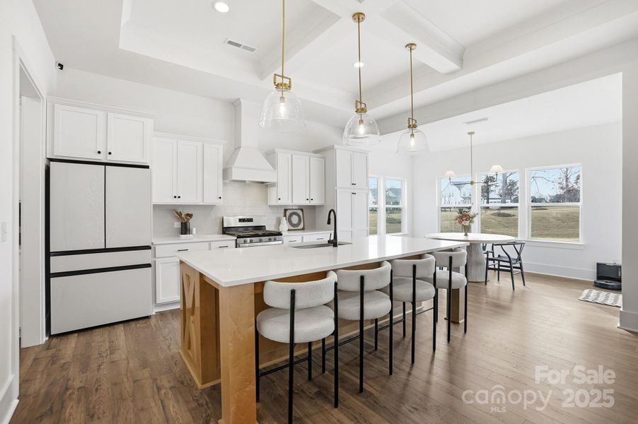 Open Kitchen with Quartz Countertops and Large Island