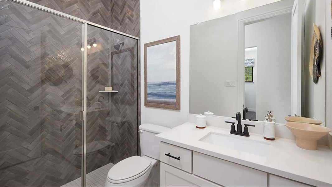 Bathroom featuring vanity and a stall shower