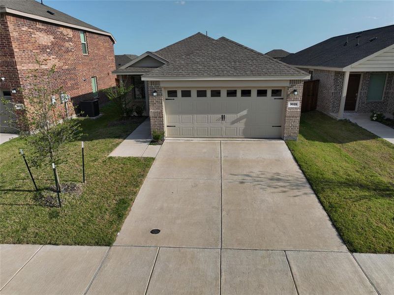 Front exterior of a new home in Hurricane Creek, Anna, TX, highlighting curb appeal (Image 2). Front exterior of a new home in Hurricane Creek, Anna, TX, highlighting curb appeal (Image 2).