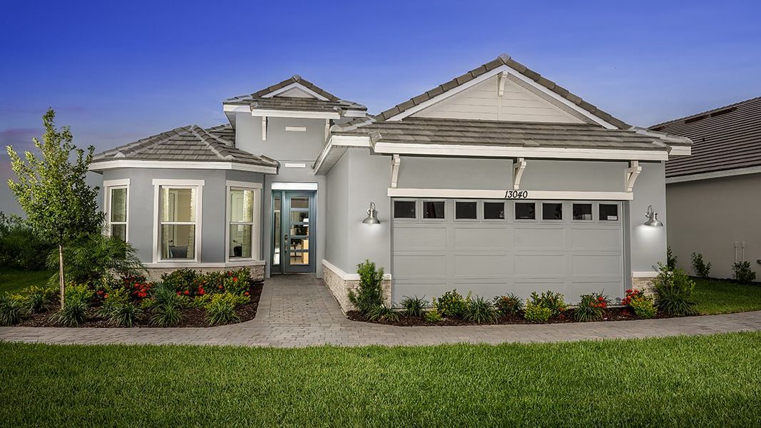 Representative exterior photo of a completed home built from the Farnese by Taylor Morrison in Astor Creek Golf and Country Club, Port St. Lucie, FL (Image 25).