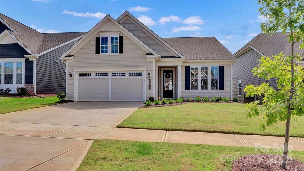 Front exterior of a new home in Cresswind Charlotte, Charlotte, NC, highlighting curb appeal (Image 21).