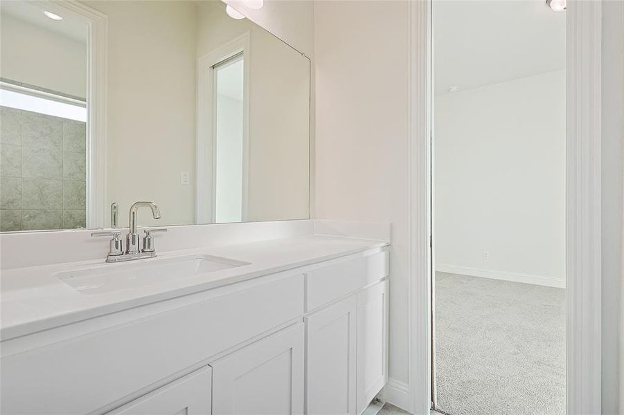 Bathroom with vanity and light colored carpet Bathroom with vanity and light colored carpet