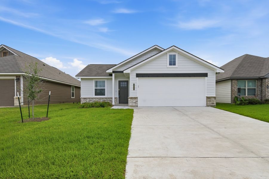 Front exterior of a new home in Bonham Trace, Bryan, TX, highlighting curb appeal (Image 20).