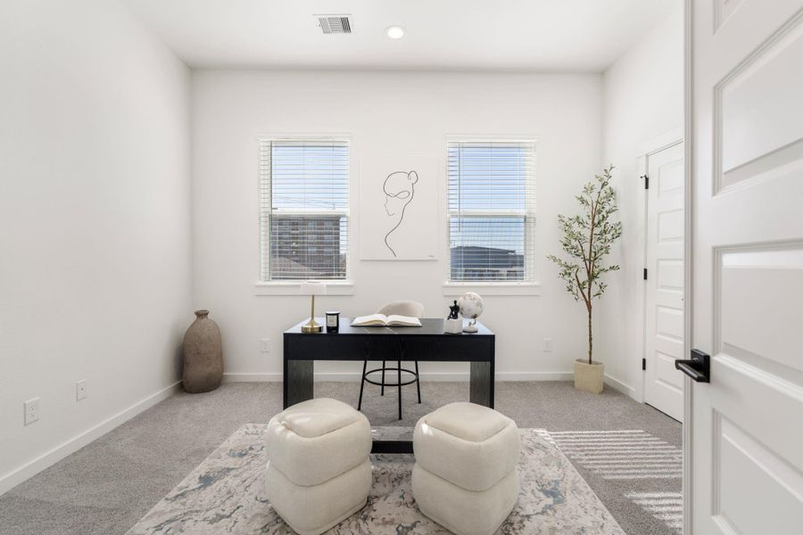Conveniently located near the primary bedroom, this room can be used for a home office or in house gym.