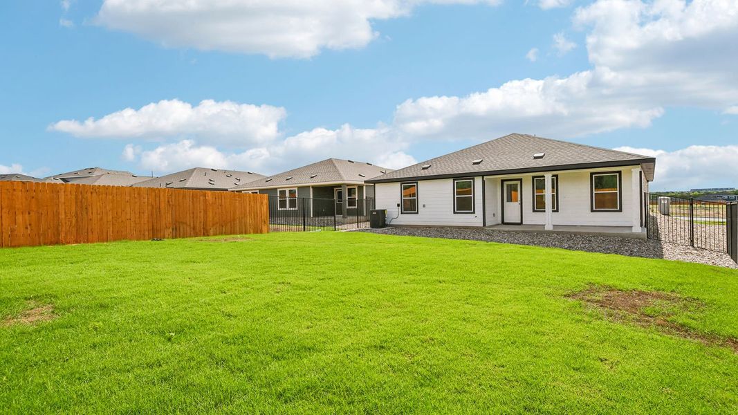 Exterior details and patio area of a home in Trails at Wildhorse, Austin (Image 20).
