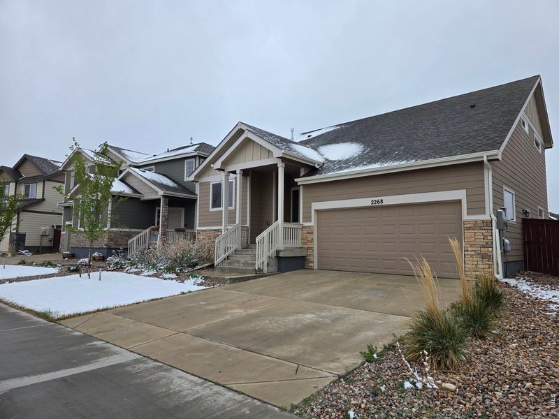 Front exterior of a new home in , Windsor, CO, highlighting curb appeal (Image 15).