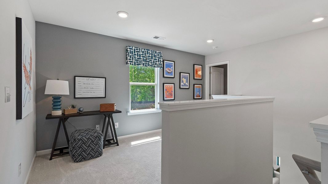 Representative furnished interior of a home built from the Reagan by DRB Homes in Towne Center, Hampton (Image 17).