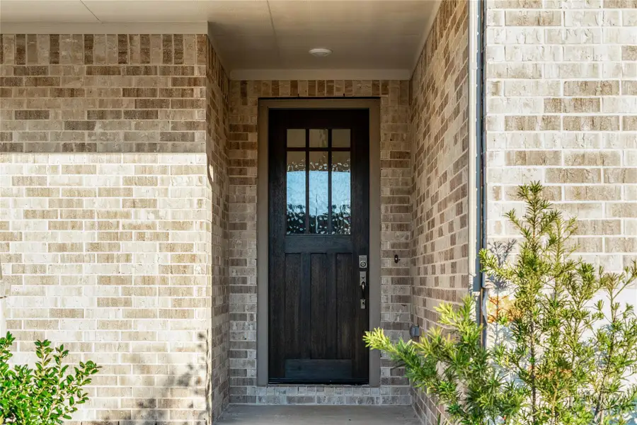 There is a warm invitation to this modern farmhouse entrance surrounded by well maintained landscaping. There is a warm invitation to this modern farmhouse entrance surrounded by well maintained landscaping.
