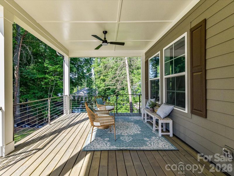 Peaceful wooded view from the covered deck overlooking a private backyard, offering a serene setting with natural privacy and scenic surroundings. Peaceful wooded view from the covered deck overlooking a private backyard, offering a serene setting with natural privacy and scenic surroundings.