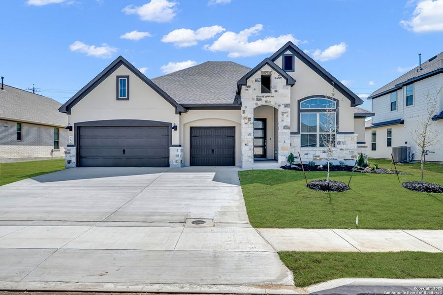 Front exterior of a new home in Buffalo Crossing, Cibolo, TX, highlighting curb appeal (Image 1). Front exterior of a new home in Buffalo Crossing, Cibolo, TX, highlighting curb appeal (Image 1).