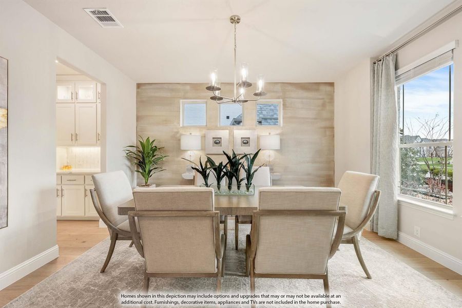 Dining room with six upholstered chairs, wood accent wall, chandelier, and large windows with natural light