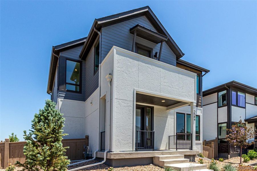 Front exterior of a new home in West Grange, Longmont, CO, highlighting curb appeal (Image 25).
