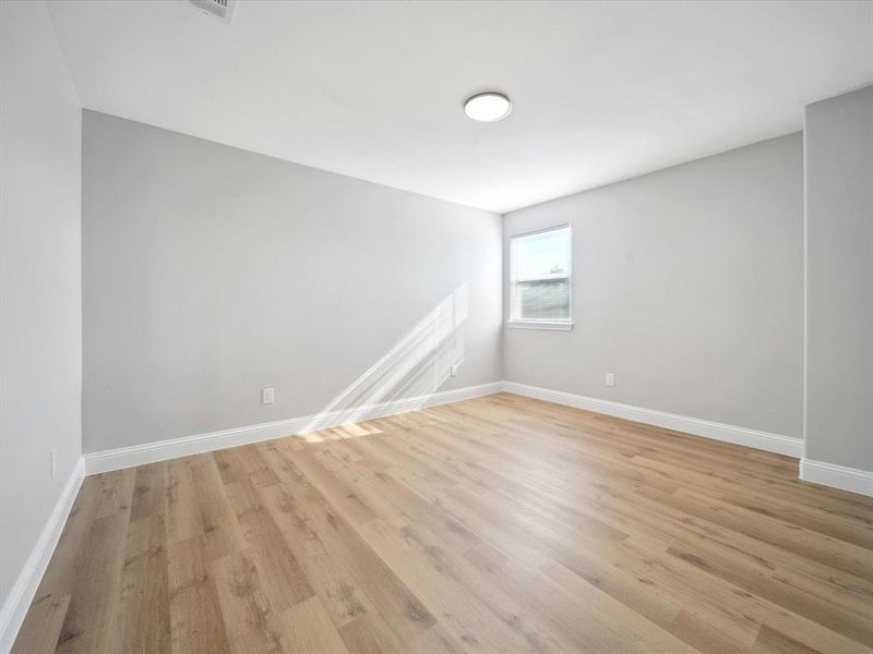 Spare room with light hardwood / wood-style floors