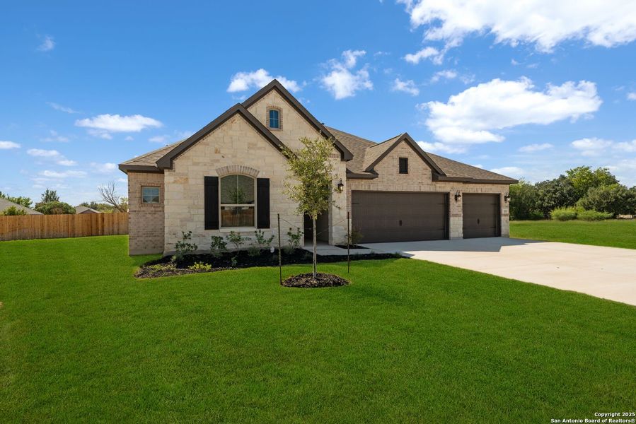 Front exterior of a new home in , Castroville, TX, highlighting curb appeal (Image 19).