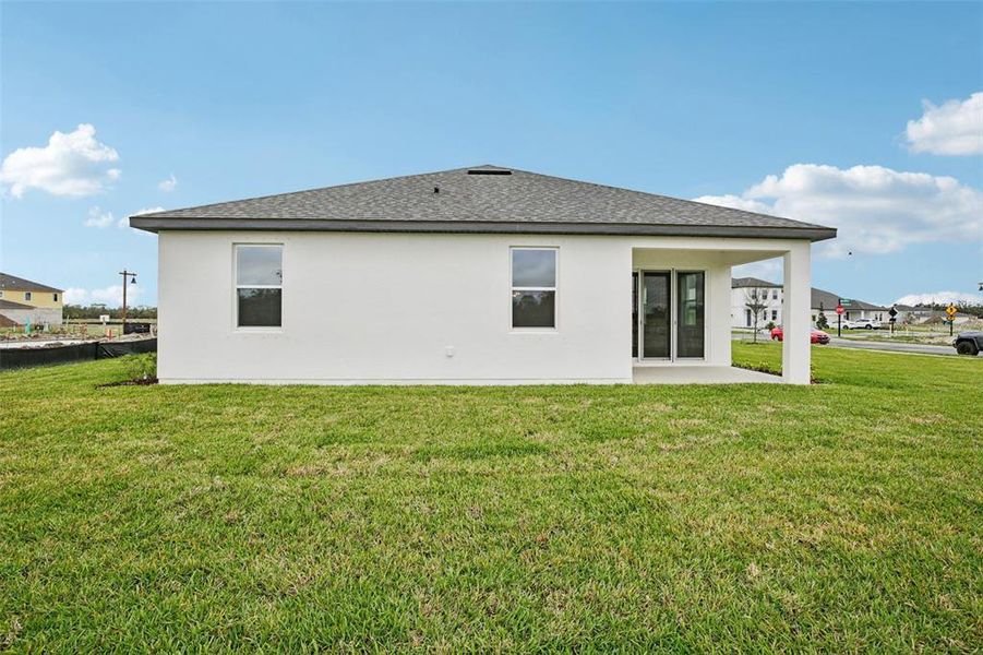 Exterior details and patio area of a home in Oakfield Trails, Parrish (Image 4).