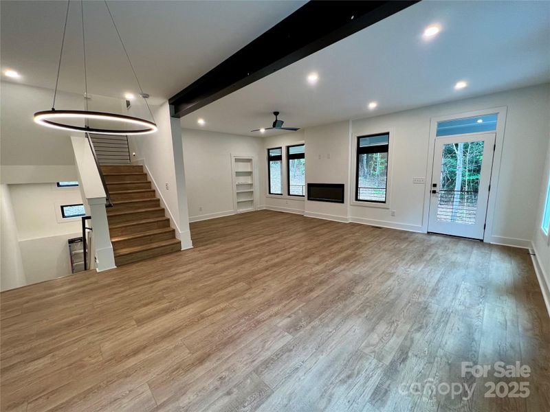 Dining area and living room with door leading to covered porch Dining area and living room with door leading to covered porch