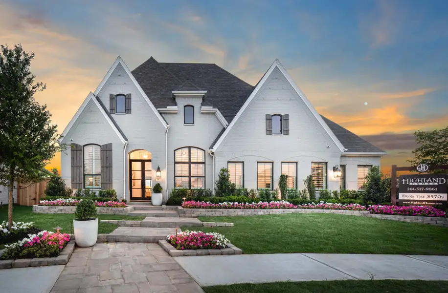 Front exterior of a new home in Jordan Ranch, Fulshear, TX, highlighting curb appeal (Image 1). Front exterior of a new home in Jordan Ranch, Fulshear, TX, highlighting curb appeal (Image 1).