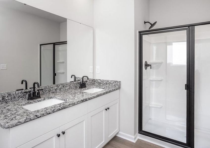 The master bathroom has double sinks