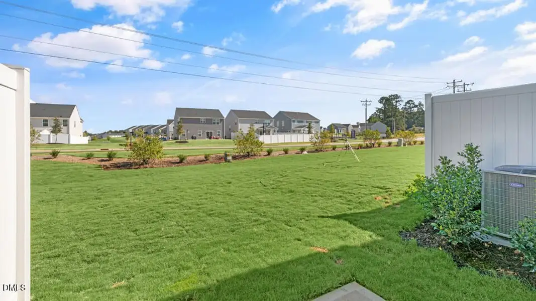 Exterior details and patio area of a home in The Townes at Ridgewood Farms, Winterville (Image 4).