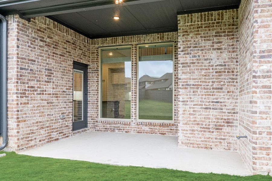 Exterior details and patio area of a home in Union Park Classic 55, Little Elm (Image 17).