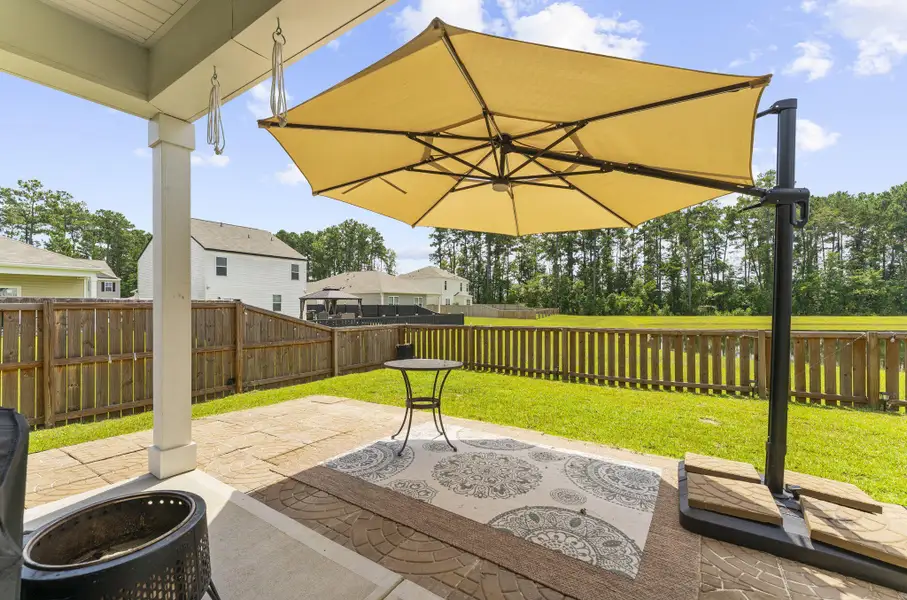 Exterior details and patio area of a home in Pine Hills at Cane Bay, Summerville (Image 25).