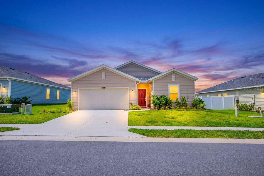 Front exterior of a new home in Trailhead Landing, Alachua, FL, highlighting curb appeal (Image 28).