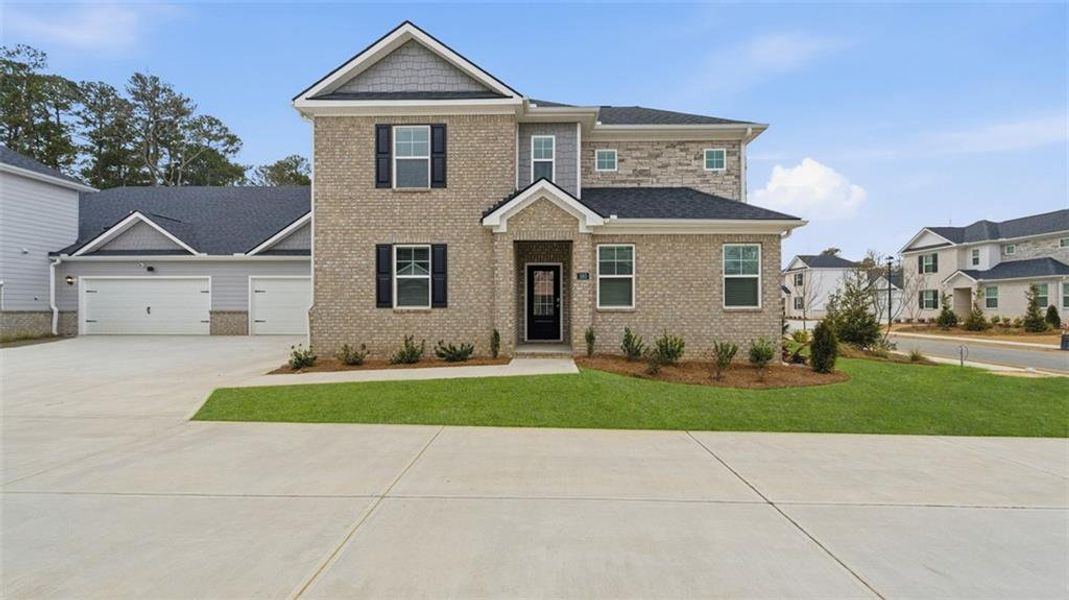 Front exterior of a new home in Independence Villas and Townhomes, Loganville, GA, highlighting curb appeal (Image 1). Front exterior of a new home in Independence Villas and Townhomes, Loganville, GA, highlighting curb appeal (Image 1).