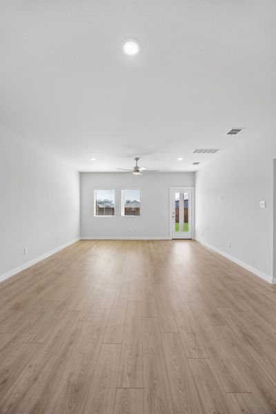 Living and Dining Rooms in the Mesquite home plan by Trophy Signature Homes – REPRESENTATIVE PHOTO