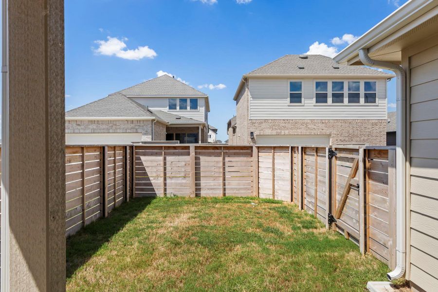 Front exterior of a new home in Flora, Hutto, TX, highlighting curb appeal (Image 18). Front exterior of a new home in Flora, Hutto, TX, highlighting curb appeal (Image 18).