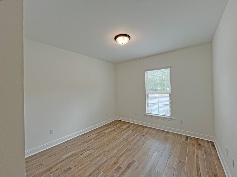 Spacious, unfurnished interior of a new home in Bird Song at Hammock Bay, Freeport (Image 18).