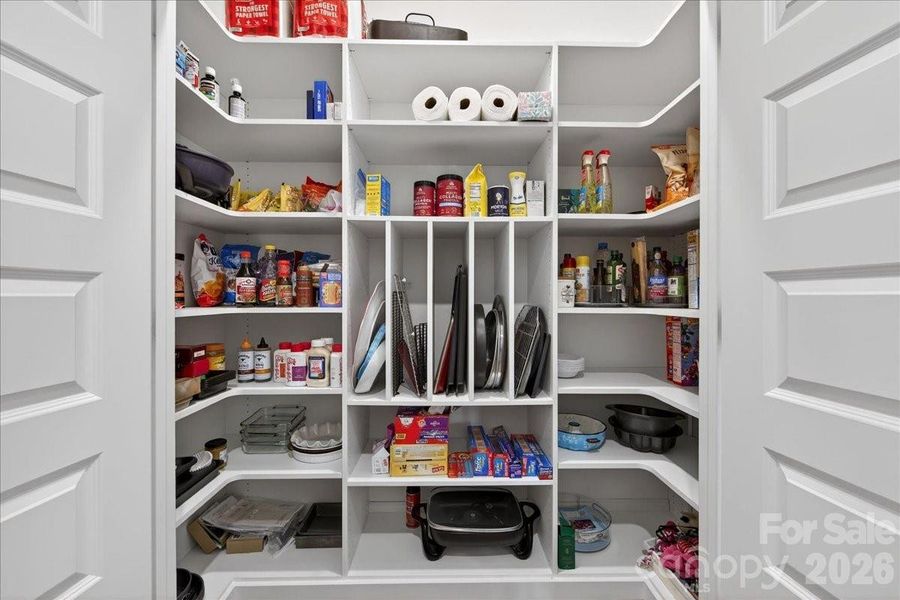 Custom built shelving maximizes the space in the pantry!
