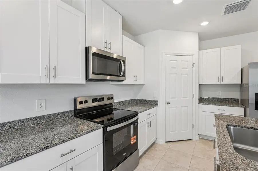 Furnished interior view inside a new home in Bradbury Creek - Signature Series, Haines City (Image 6).