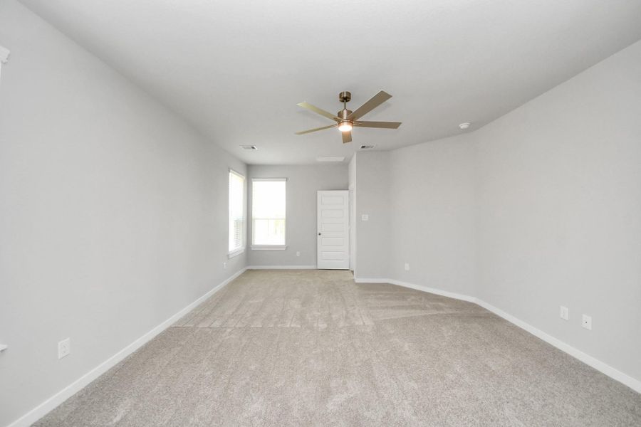 Indulge in relaxation in the magnificent primary suite following a busy day! This roomy haven showcases plush carpet, inviting paint colors, high ceilings, and generous windows with privacy blinds. Sample photo of completed home with similar floor plan. Actual colors and selections may vary. Indulge in relaxation in the magnificent primary suite following a busy day! This roomy haven showcases plush carpet, inviting paint colors, high ceilings, and generous windows with privacy blinds. Sample photo of completed home with similar floor plan. Actual colors and selections may vary.