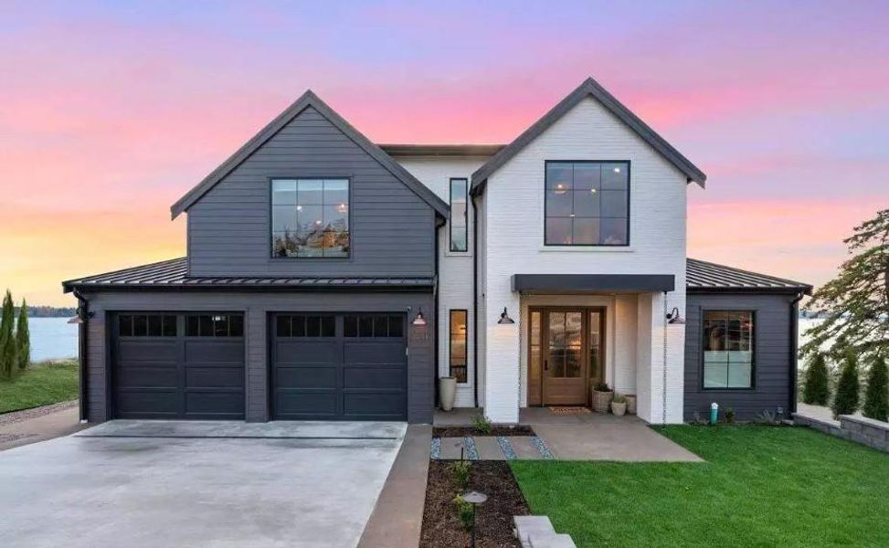 Modern Farmhosue with Brick and Lap Siding, Black Windows and 2 Car garage