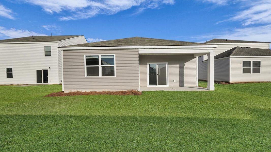 Exterior details and patio area of a home in Pine Hills at Cane Bay, Summerville (Image 21). Exterior details and patio area of a home in Pine Hills at Cane Bay, Summerville (Image 21).
