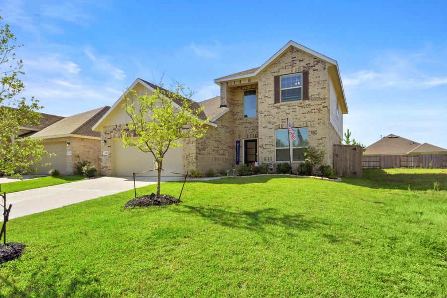 Front exterior of a new home in , Conroe, TX, highlighting curb appeal (Image 19).