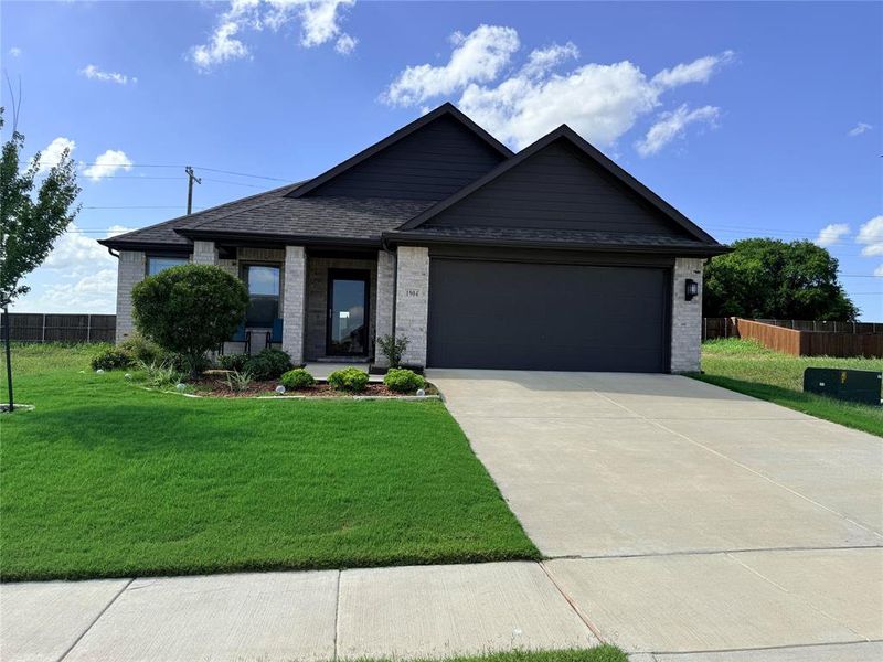 Contemporary single-story residence featuring a brick and siding exterior Contemporary single-story residence featuring a brick and siding exterior