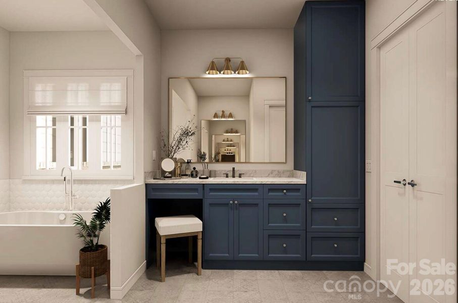 Navy blue cabinetry with marble countertops and brass fixtures adds a bold yet elegant touch, complemented by a dedicated vanity area and built-in storage tower for optimal functionality. Navy blue cabinetry with marble countertops and brass fixtures adds a bold yet elegant touch, complemented by a dedicated vanity area and built-in storage tower for optimal functionality.