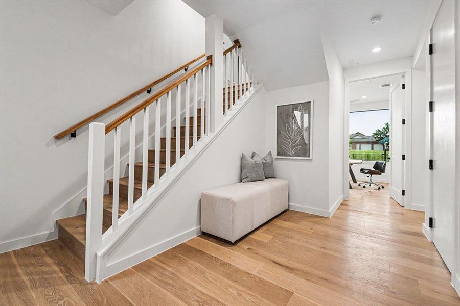 Entry with stairs leading to main floor living or 2 bedrooms, one bathroom downstairs.