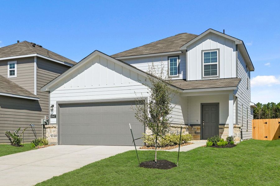 Front exterior of a new home in Northpark South, Porter, TX, highlighting curb appeal (Image 1). Front exterior of a new home in Northpark South, Porter, TX, highlighting curb appeal (Image 1).