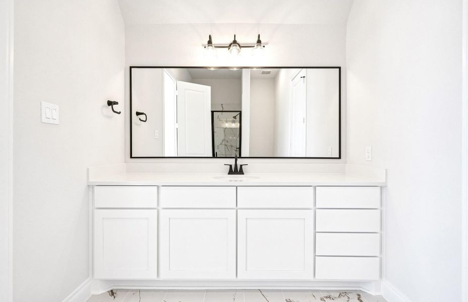 Furnished interior view inside a new home in Bridgeland 60′, Cypress (Image 8).